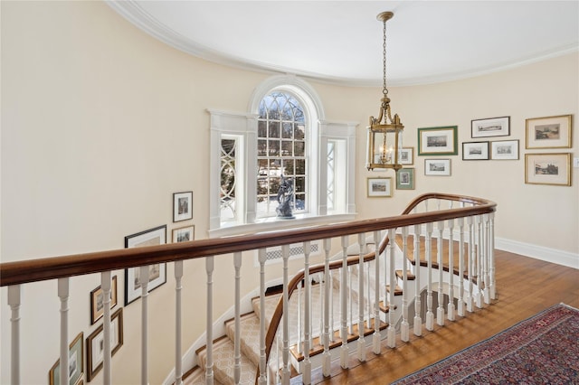 133AKA139 Hampshire Rd, Bronxville, NY 10708 - stairs with ornamental molding, a chandelier, baseboards, and wood finished floors