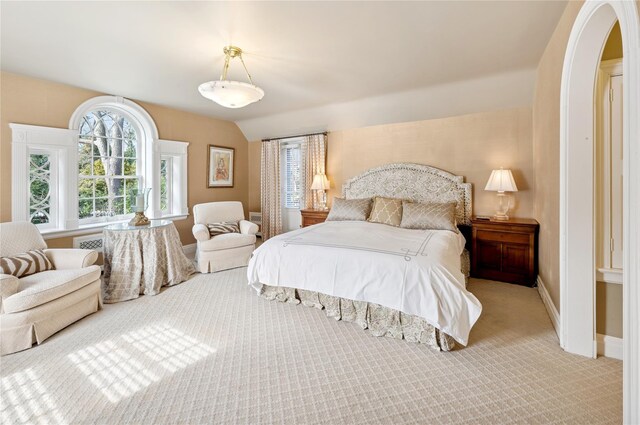 133AKA139 Hampshire Rd, Bronxville, NY 10708 - carpeted bedroom featuring multiple windows, baseboards, and arched walkways