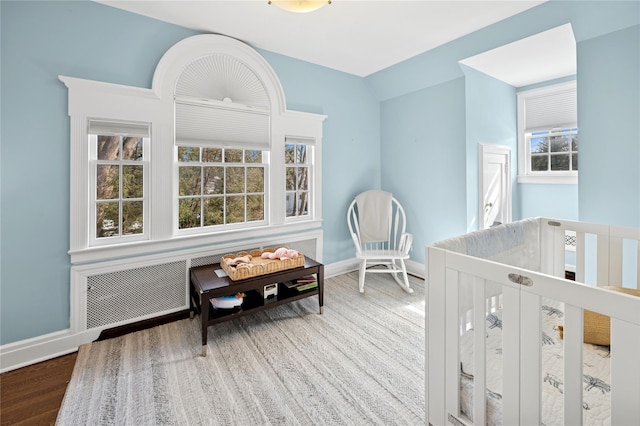 133AKA139 Hampshire Rd, Bronxville, NY 10708 - interior space featuring wood finished floors, baseboards, vaulted ceiling, and radiator