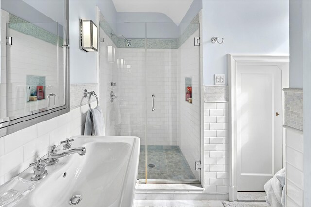133AKA139 Hampshire Rd, Bronxville, NY 10708 - bathroom with a sink, tile walls, and a stall shower