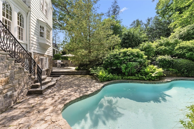 133AKA139 Hampshire Rd, Bronxville, NY 10708 - outdoor pool with stairs, a patio area, and outdoor dining area