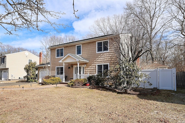 view of front of home featuring a front lawn and a garage