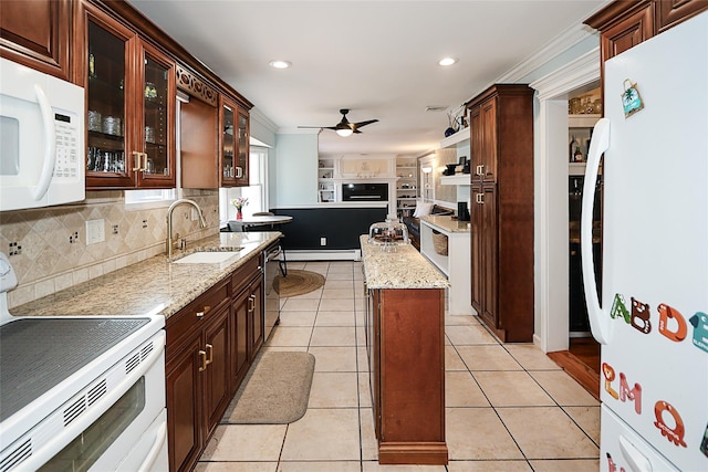 kitchen featuring white appliances, sink, light tile patterned flooring, a baseboard heating unit, and ceiling fan