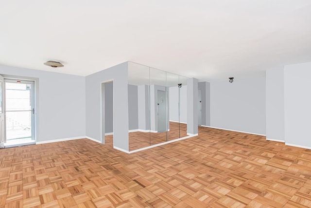 spare room with light parquet flooring