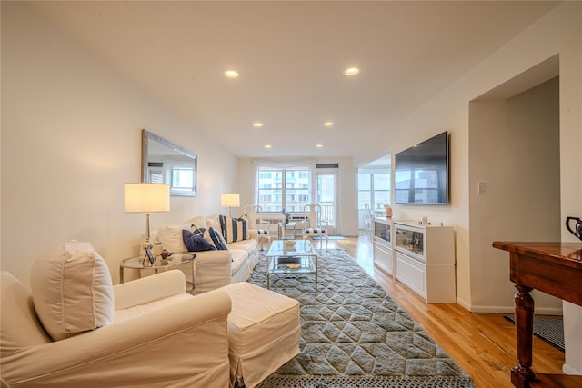 living room with light hardwood / wood-style flooring