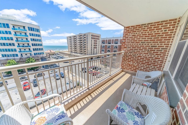 balcony featuring a water view