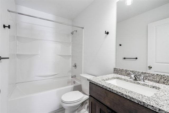 full bathroom featuring bathing tub / shower combination, toilet, and vanity