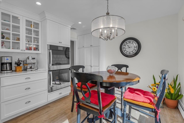 dining space with recessed lighting, light wood-style floors, visible vents, and a chandelier