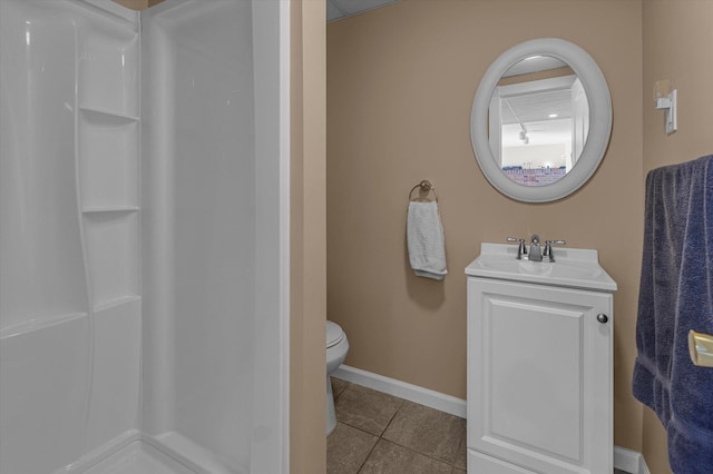 full bathroom featuring tile patterned floors, vanity, a shower, and baseboards