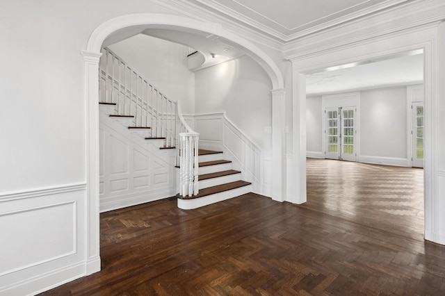 interior space with ornamental molding and parquet floors