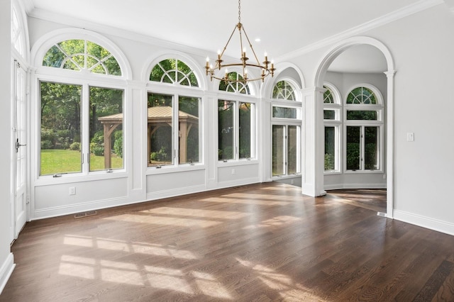 unfurnished sunroom featuring a notable chandelier