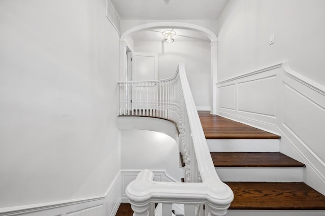 stairway with hardwood / wood-style floors