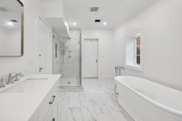 bathroom with separate shower and tub and vanity