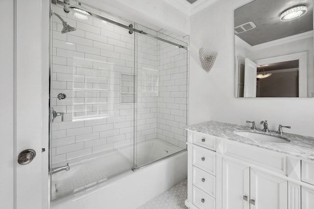 bathroom featuring vanity, combined bath / shower with glass door, and crown molding