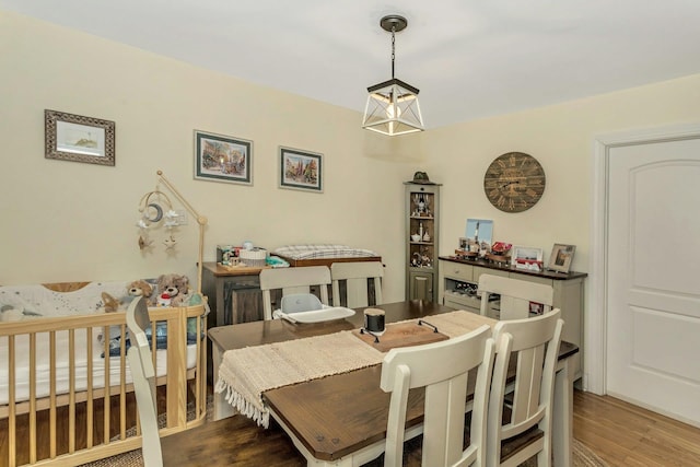 dining area with wood finished floors