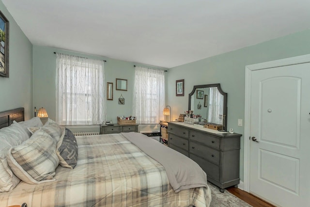 bedroom featuring wood finished floors