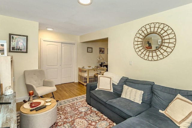 living room featuring baseboards and wood finished floors