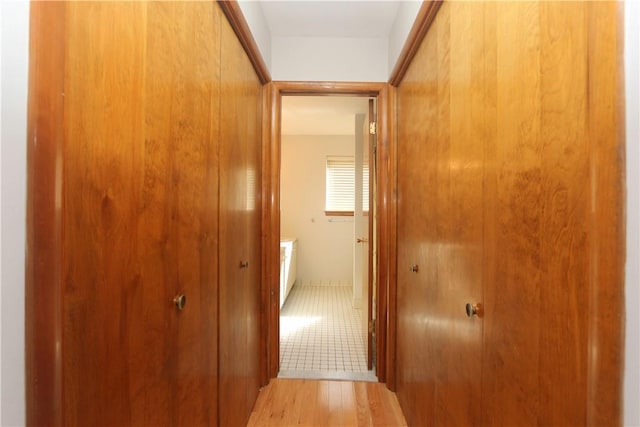 corridor featuring light tile patterned flooring