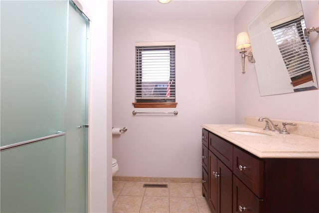 bathroom featuring visible vents, baseboards, toilet, tile patterned flooring, and vanity