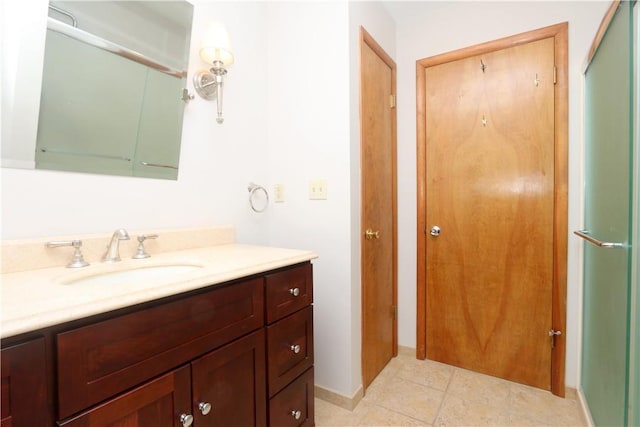 full bathroom with a shower with shower door and vanity