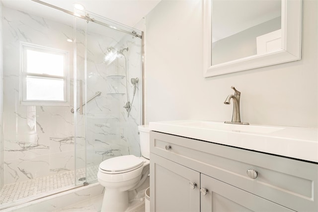 full bath featuring toilet, marble finish floor, a marble finish shower, and vanity