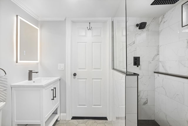 bathroom with baseboards, crown molding, vanity, and a marble finish shower