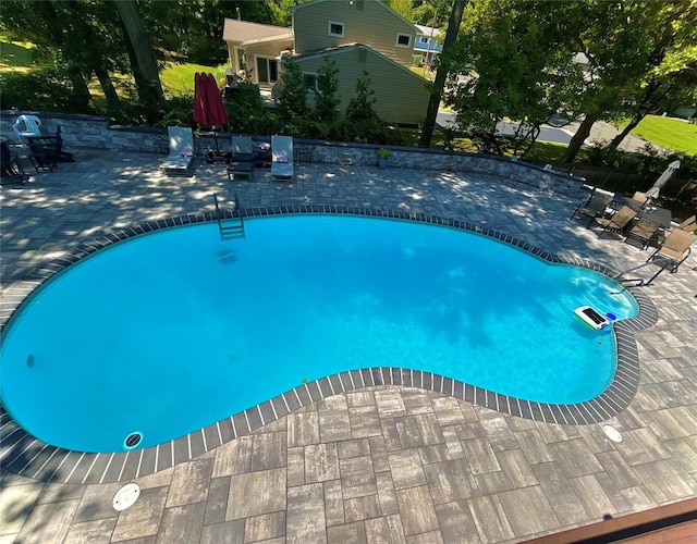 pool with a patio area