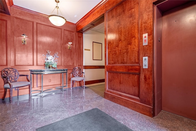 interior space featuring ornamental molding and elevator