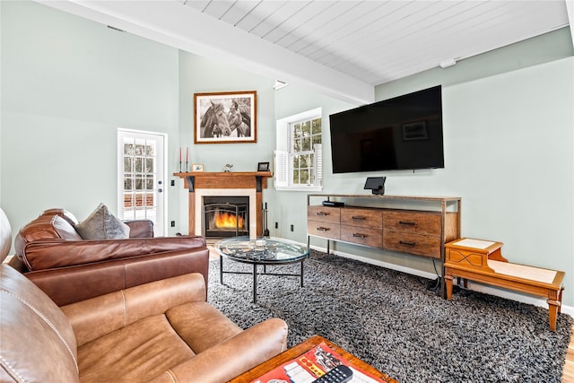 living room with vaulted ceiling with beams and wood ceiling