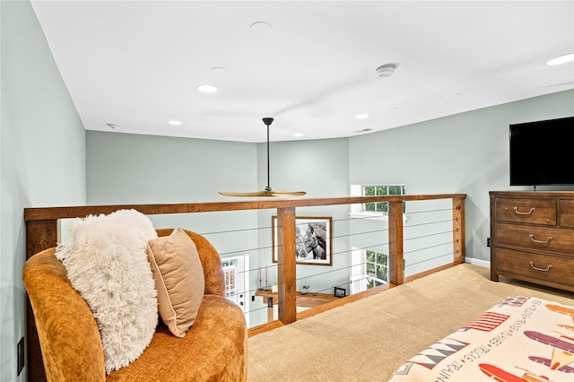 carpeted bedroom featuring multiple windows