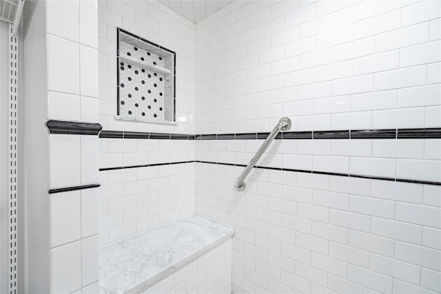 bathroom with a tile shower