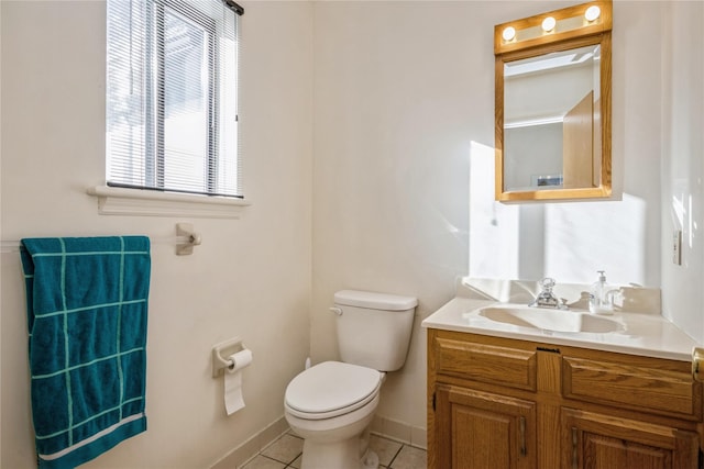 bathroom featuring tile patterned floors, vanity, and toilet