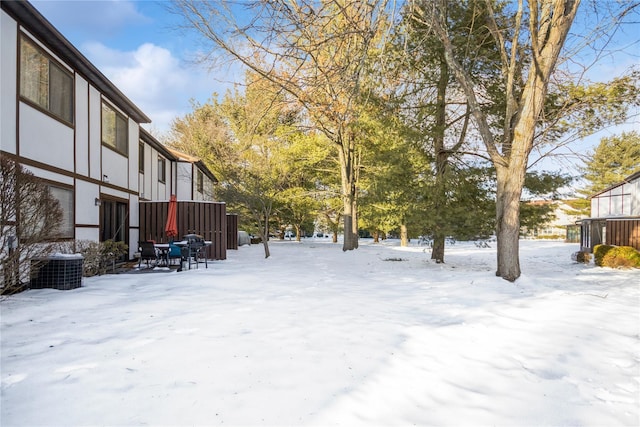 view of yard layered in snow