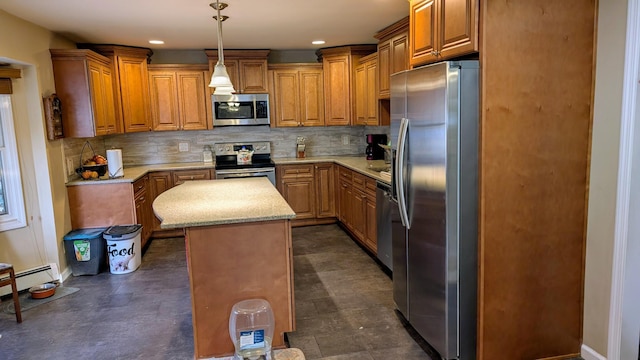 kitchen with tasteful backsplash, a center island, appliances with stainless steel finishes, brown cabinetry, and hanging light fixtures