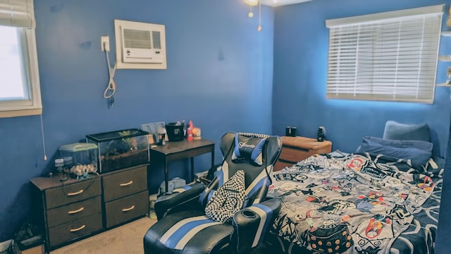 bedroom featuring carpet and a wall mounted AC