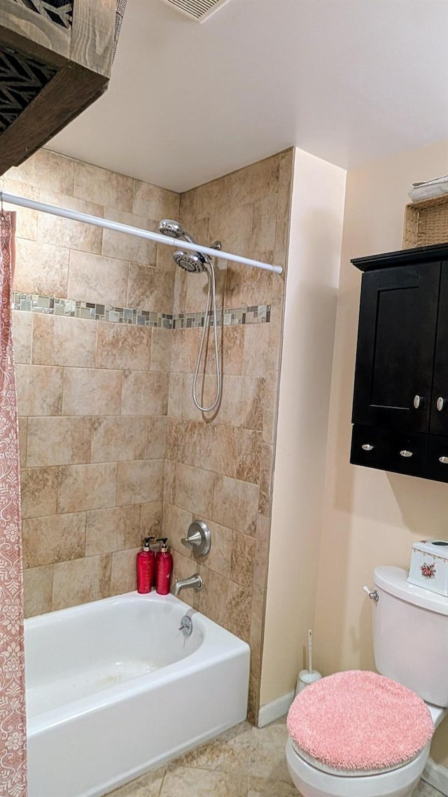 bathroom with tile patterned flooring, shower / tub combo, toilet, and baseboards