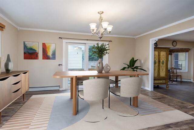 dining area with a baseboard heating unit, a chandelier, baseboard heating, crown molding, and wood finished floors