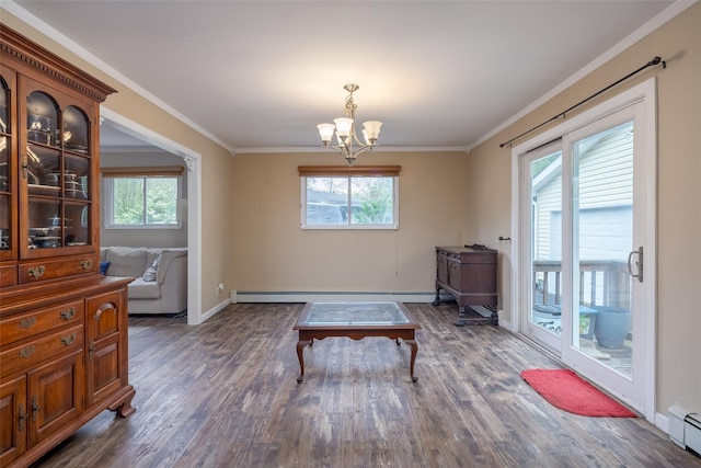 sitting room with a chandelier, wood finished floors, ornamental molding, a baseboard heating unit, and baseboards