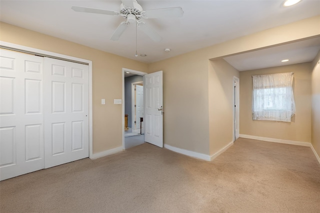 unfurnished bedroom featuring carpet flooring, baseboards, a closet, recessed lighting, and ceiling fan