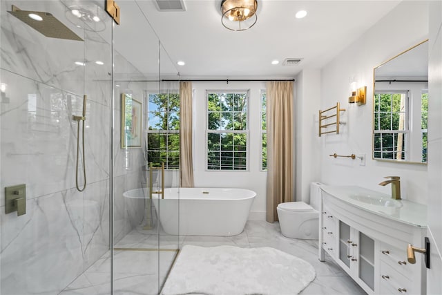 bathroom with marble finish floor, a healthy amount of sunlight, vanity, and a marble finish shower