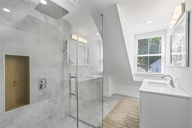 full bathroom with recessed lighting, a marble finish shower, baseboards, and vanity