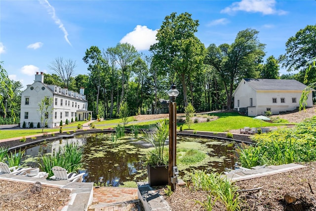 view of home's community featuring a lawn