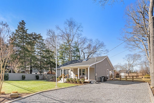 view of front of house with a front lawn and a porch