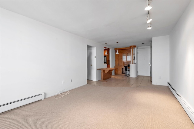 unfurnished living room with track lighting, a baseboard radiator, light tile patterned floors, and light carpet