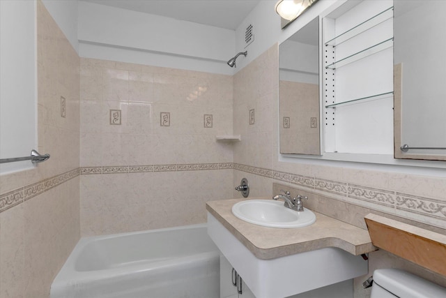 full bathroom featuring toilet, shower / tub combination, visible vents, and a sink