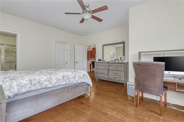 bedroom featuring ceiling fan, ensuite bathroom, and light hardwood / wood-style floors