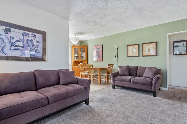 carpeted living area with a textured ceiling