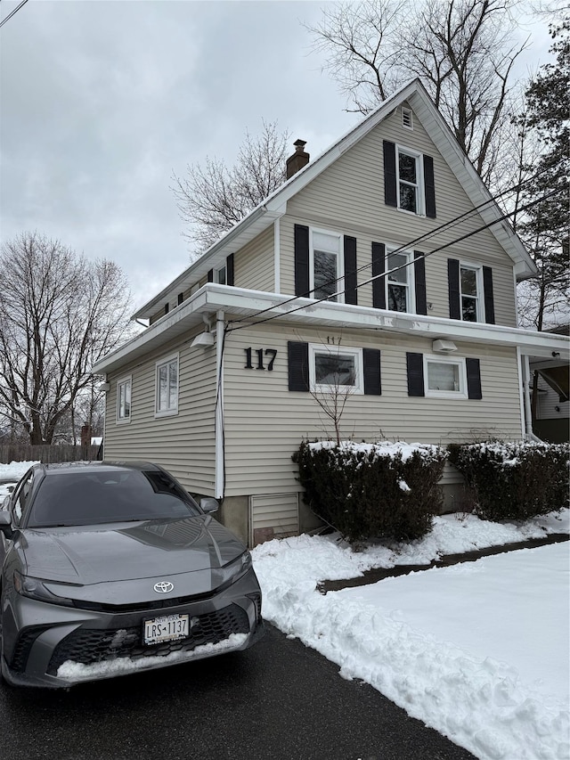 view of front of home with a chimney