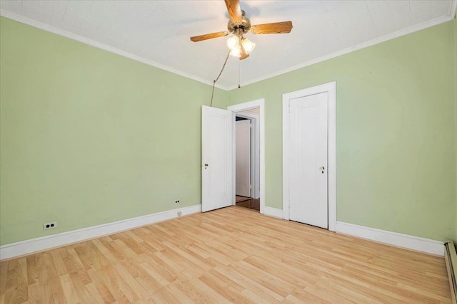 unfurnished bedroom with baseboards, a ceiling fan, a baseboard radiator, light wood-style flooring, and crown molding