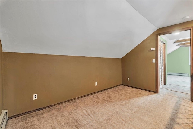 bonus room featuring a baseboard radiator, light colored carpet, vaulted ceiling, and baseboard heating